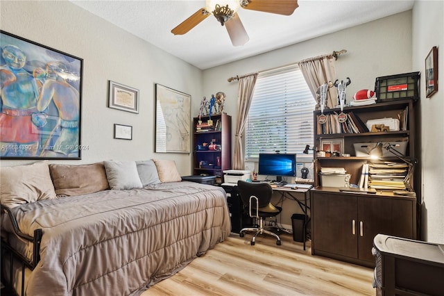 bedroom with a ceiling fan and light wood finished floors