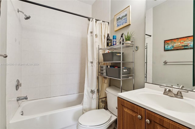 bathroom with toilet, shower / bath combination with curtain, and vanity