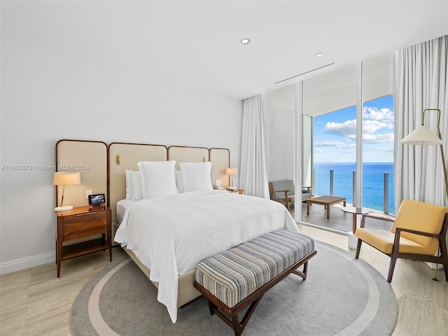 bedroom featuring a water view