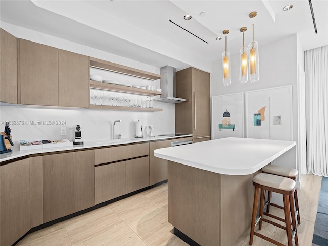 525 N Fort Lauderdale Beach Blvd Unit 1505, Fort Lauderdale, FL 33304 - kitchen featuring wall chimney range hood, open shelves, a breakfast bar, light countertops, and pendant lighting
