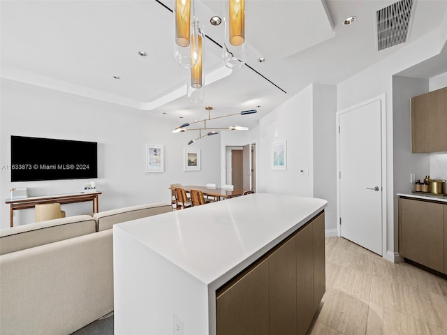 kitchen with a center island and a chandelier