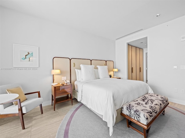 bedroom featuring light wood-type flooring