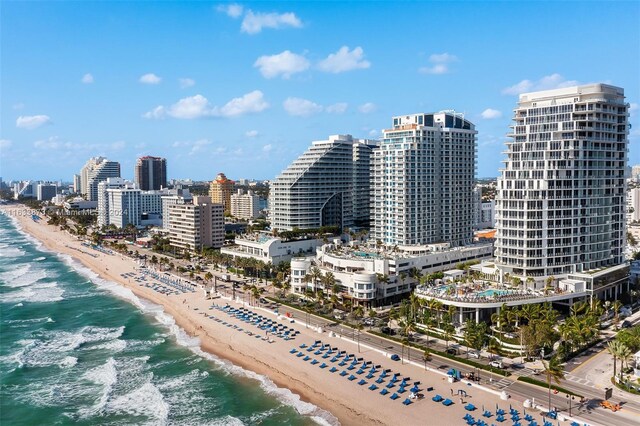 bird's eye view with a beach view and a water view