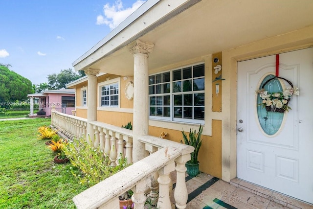 property entrance with a yard