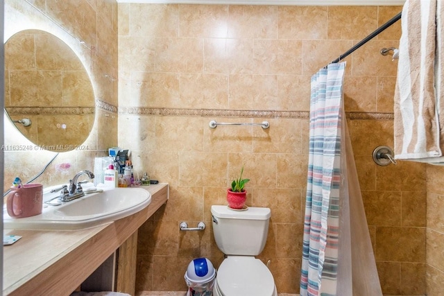 bathroom featuring sink, toilet, and tile walls