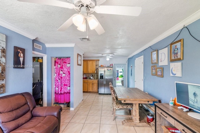 dining room with ornamental molding, light tile patterned floors, and ceiling fan