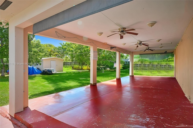 view of patio / terrace featuring a storage shed and ceiling fan