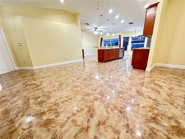 kitchen with vaulted ceiling, ceiling fan, sink, a center island, and hanging light fixtures