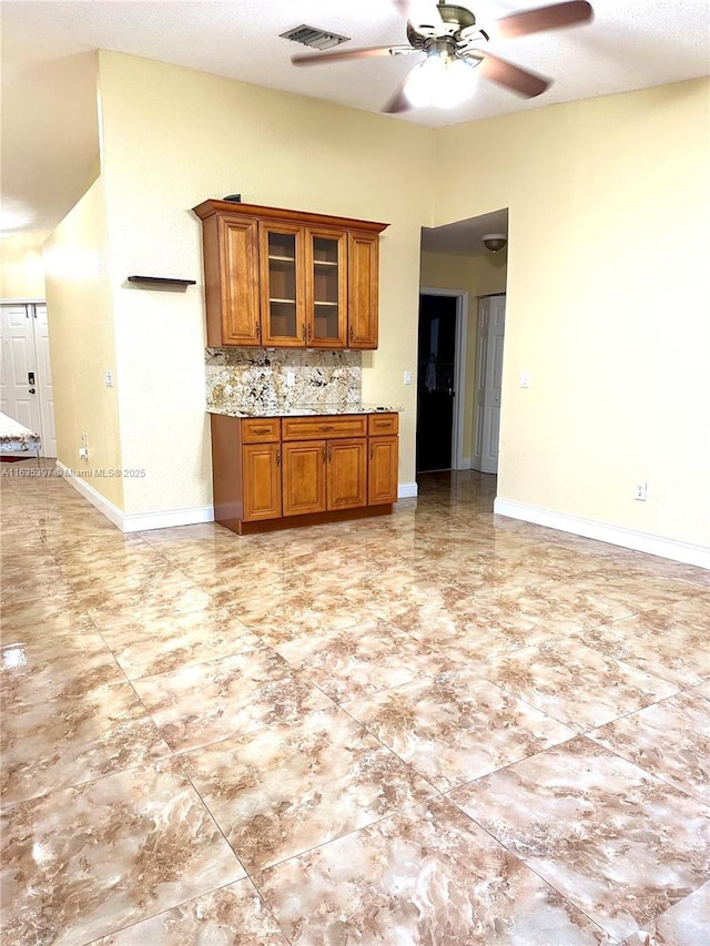 kitchen with decorative backsplash and ceiling fan