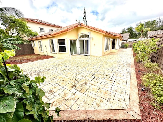 back of house featuring a patio area