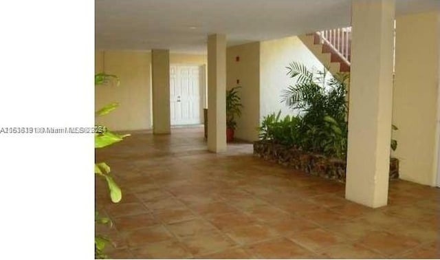 hallway featuring tile patterned floors