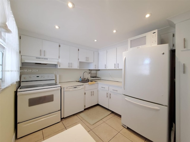 kitchen featuring white cabinets, sink, white appliances, and light tile patterned floors