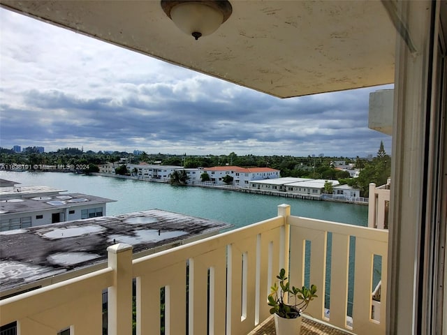 balcony featuring a water view