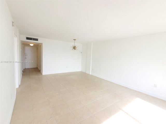 empty room with light tile patterned floors