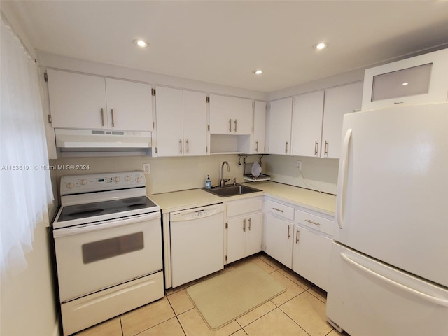 kitchen with sink, white cabinets, white appliances, and light tile patterned floors