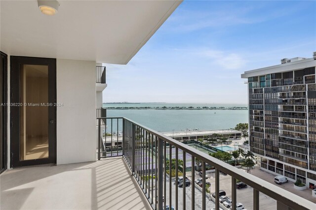 balcony featuring a water view