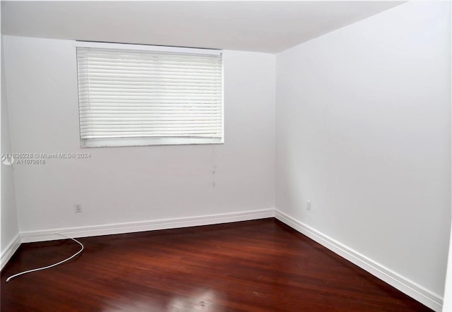 spare room with hardwood / wood-style flooring