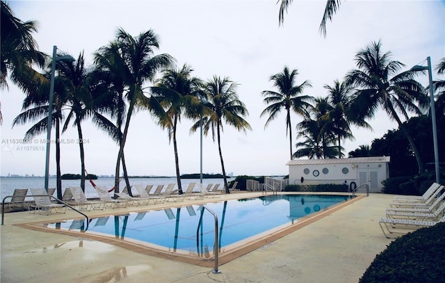 view of swimming pool featuring a patio area