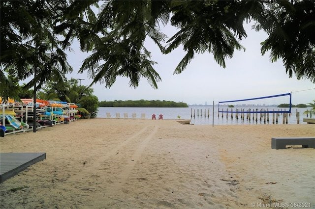 view of community with a water view and volleyball court