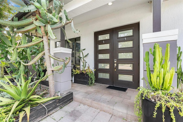 entrance to property featuring french doors