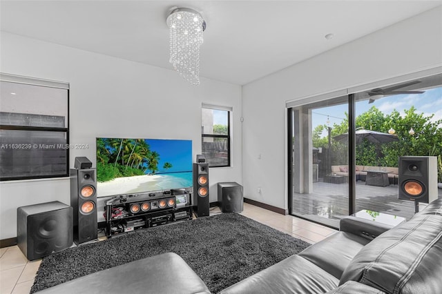 tiled living room featuring a notable chandelier