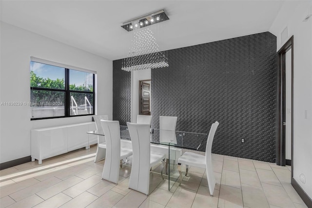 tiled dining area with a notable chandelier