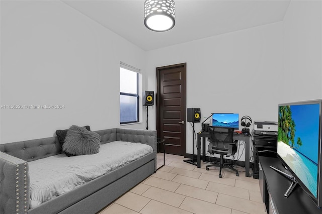 bedroom with light tile patterned floors