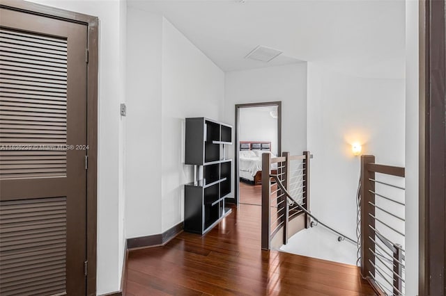 hallway featuring dark hardwood / wood-style floors