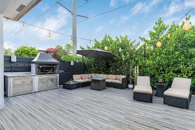 wooden deck with an outdoor living space