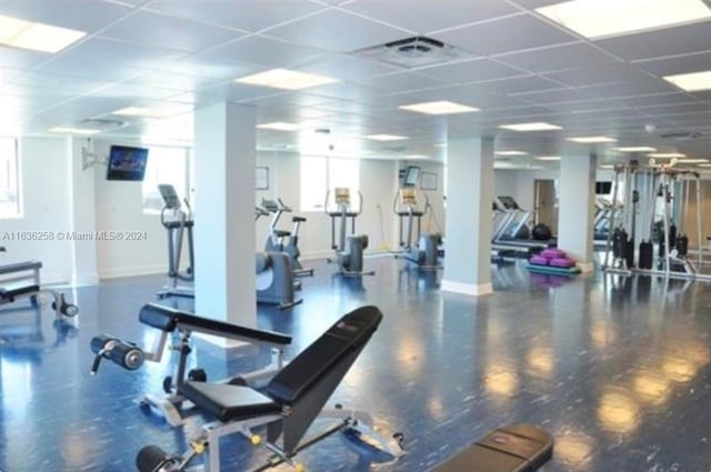 gym featuring a paneled ceiling