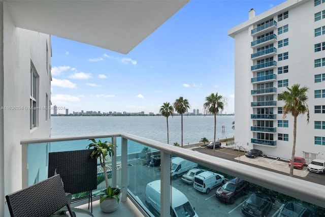 balcony featuring a water view