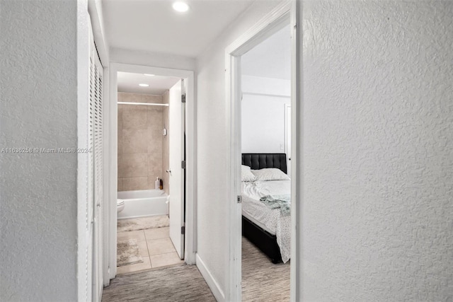 corridor with light tile patterned flooring