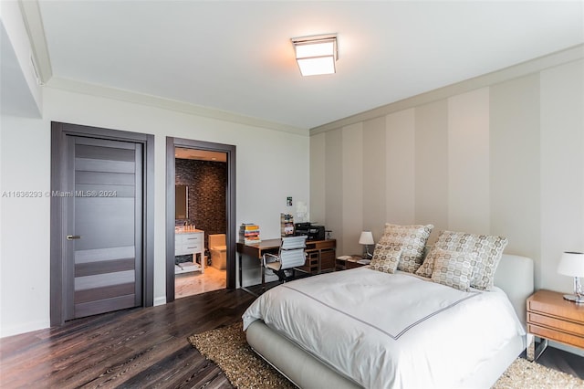 bedroom with hardwood / wood-style floors and crown molding