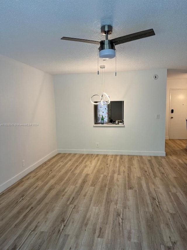 interior space with hardwood / wood-style floors and a textured ceiling