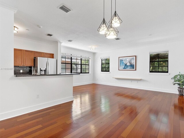 unfurnished living room featuring dark wood-type flooring