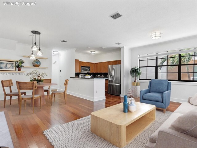 spare room with crown molding and dark wood-type flooring