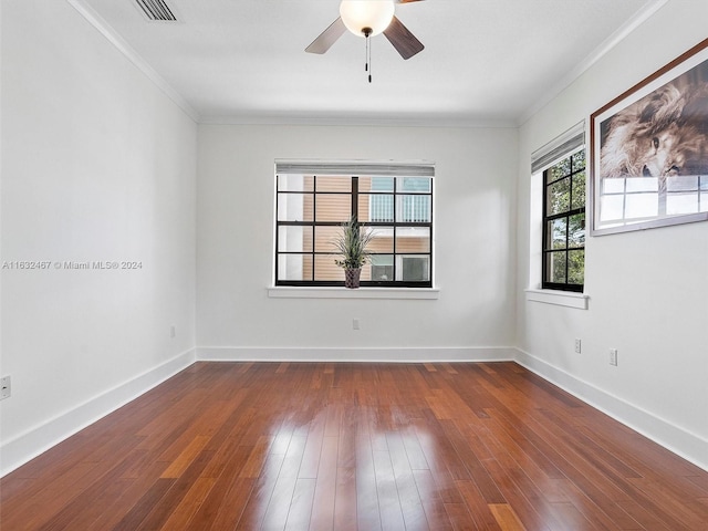 unfurnished room featuring ceiling fan, ornamental molding, and dark hardwood / wood-style floors