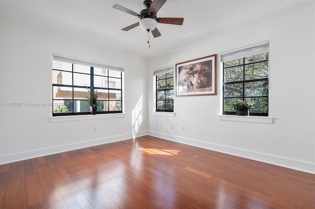 unfurnished room featuring ornamental molding, hardwood / wood-style floors, and ceiling fan