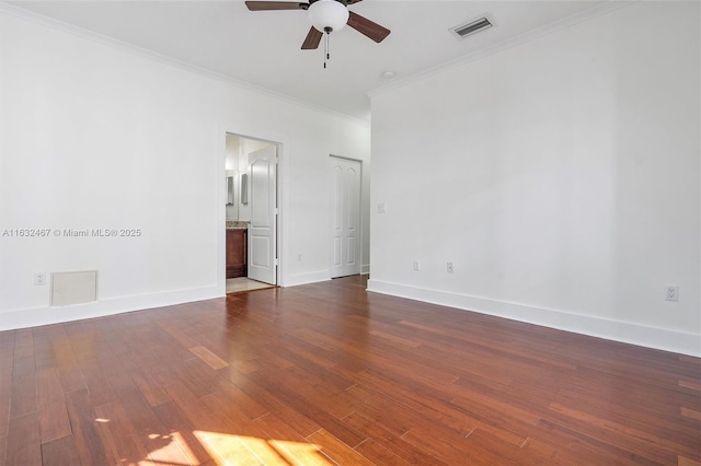 unfurnished room with crown molding, dark hardwood / wood-style floors, and ceiling fan