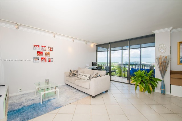 tiled living room featuring a wall of windows and crown molding