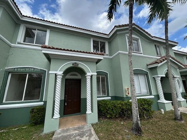1519 SE 24th Ct Unit 238, Homestead, FL 33035 - view of front of house featuring stucco siding and a tiled roof