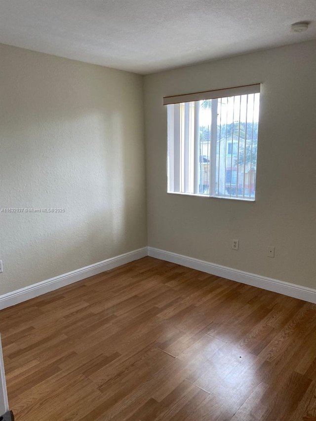 1519 SE 24th Ct Unit 238, Homestead, FL 33035 - empty room with baseboards and wood finished floors