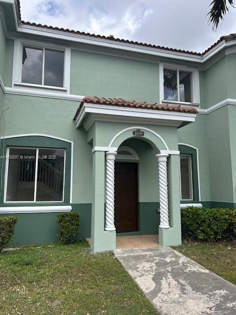 1519 SE 24th Ct Unit 238, Homestead, FL 33035 - view of front of property featuring a tiled roof and stucco siding