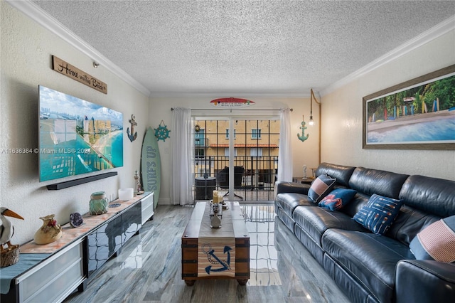 living room with hardwood / wood-style floors, ornamental molding, and a textured ceiling