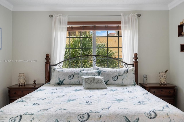 bedroom with ornamental molding