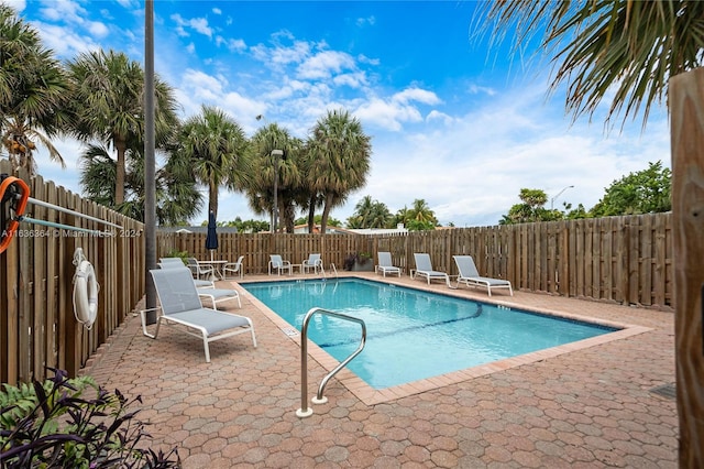 view of swimming pool featuring a patio area