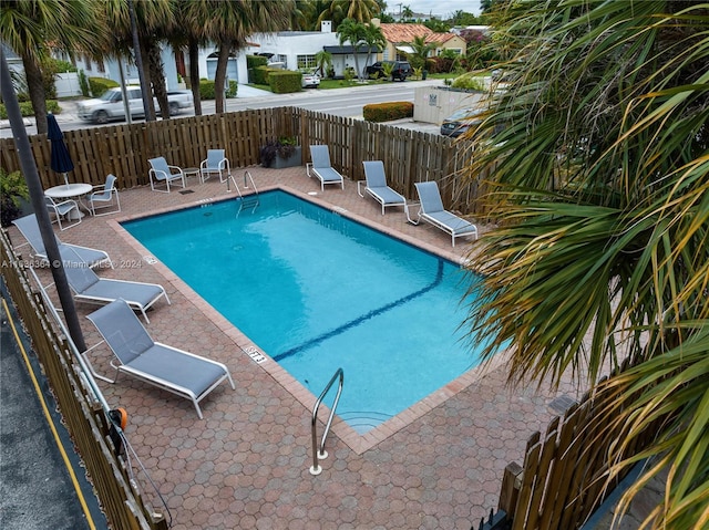 view of swimming pool featuring a patio area