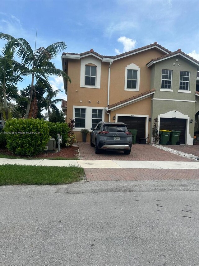 view of front of property with a garage