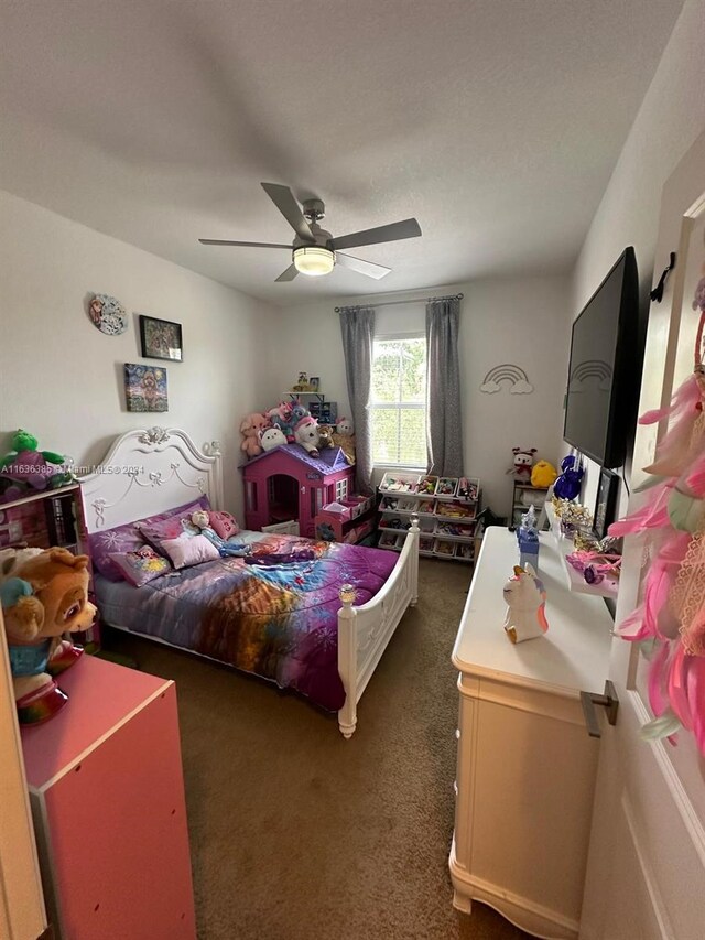 carpeted bedroom featuring ceiling fan