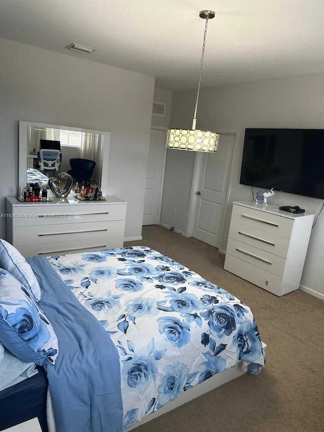 bedroom featuring light colored carpet